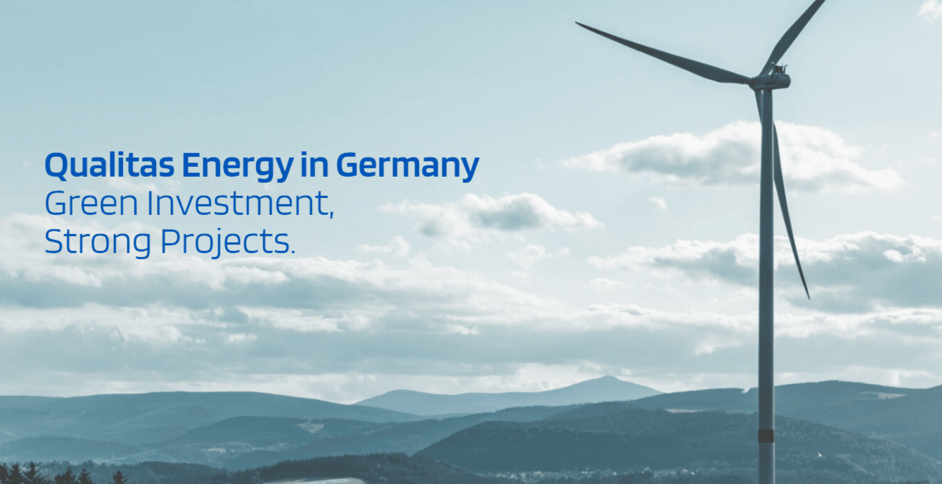 A wind turbine stands against a cloudy sky and distant hills, with the text Qualitas Energy in Germany: Green Investment, Strong Projects in blue on the left side.