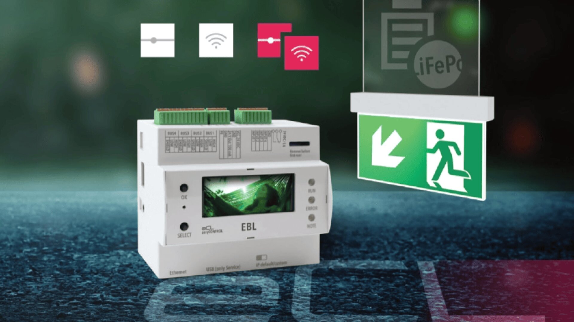 A white electronic device with a small screen and green connectors is shown next to an illuminated emergency exit sign. Wi-Fi and connectivity icons appear above the device, with a blurred background.