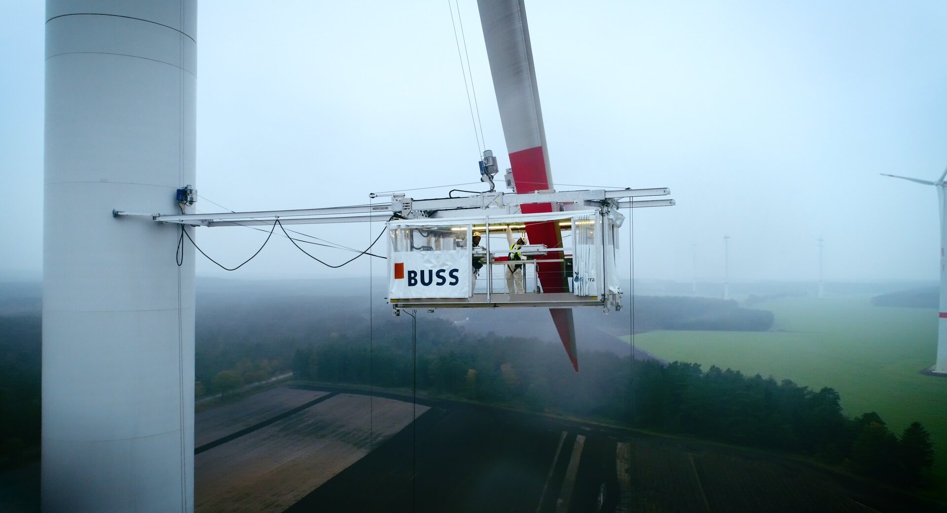 A helicopter with people on board.